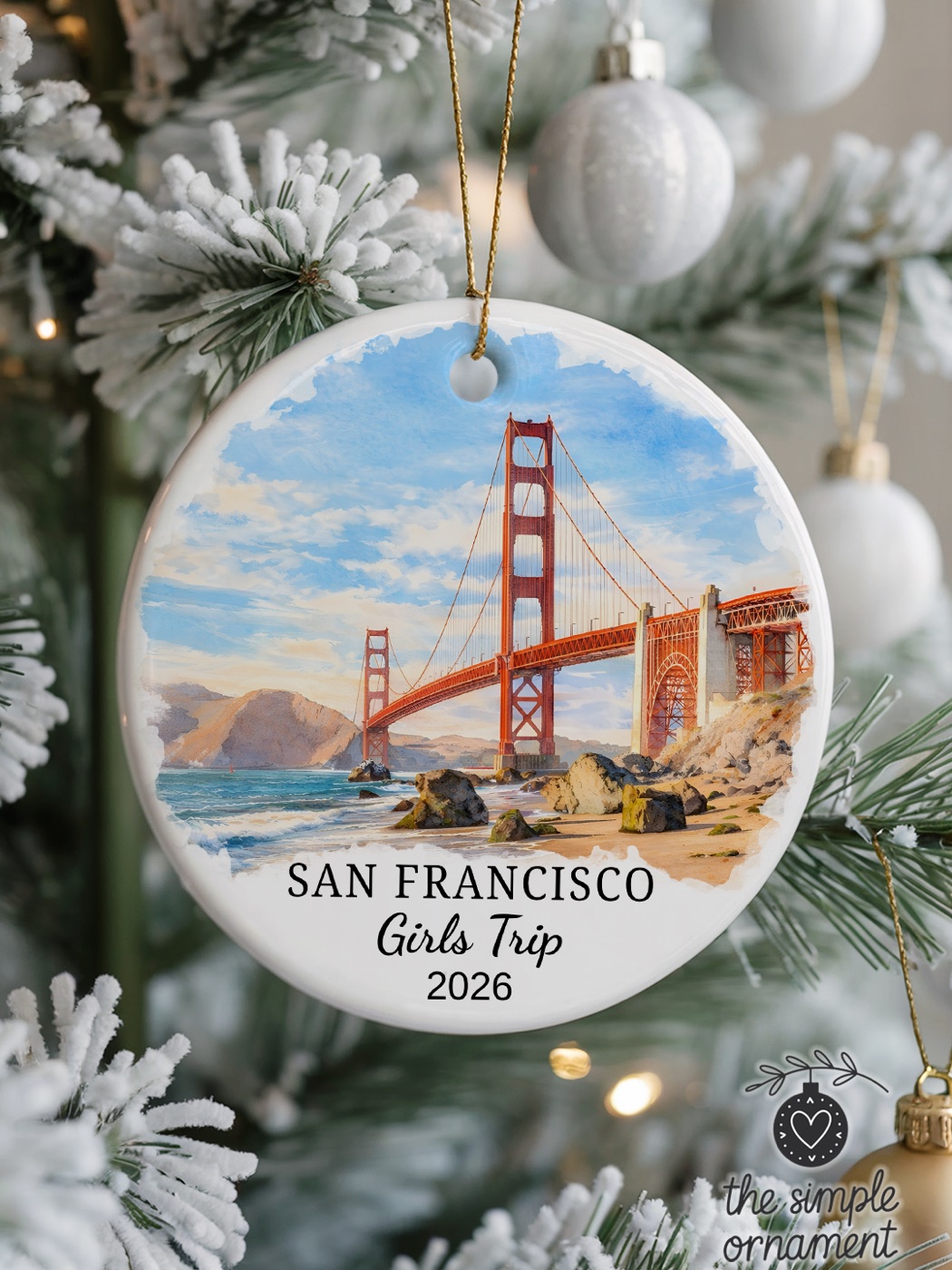 Personalized San Francisco travel ornament hanging on a winter tree